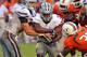 MIAMI GARDENS, FL - SEPTEMBER 24: Quarterback Collin Klein #7 of the Kansas State University Wildcats fakes a handoff to running back John Hubert #33 against the Miami Hurricanes September 24, 2011 at Sun Life Stadium in Miami Gardens, Florida. (Photo by Al Messerschmidt/Getty Images)