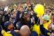 ANN ARBOR, MI - NOVEMBER 26: Denard Robinson #16 of the Michigan Wolverines celebrates with students after beating Ohio State 40-34 at Michigan Stadium on November 26, 2011 in Ann Arbor, Michigan. (Photo by Gregory Shamus/Getty Images)