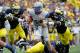 ANN ARBOR, MI - SEPTEMBER 08: Connor Dietz #11 of the Air Force Falcons tries to get past the tackle of Frank Clark #57 of the Michigan Wolverines during a fourth quarter run at Michigan Stadium on September 8, 2012 in Ann Arbor, Michigan. (Photo by Gregory Shamus/Getty Images)