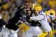 BATON ROUGE, LA - SEPTEMBER 08: Keith Price #17 of the Washington Huskies is pressured by Lavar Edwards #89 of the LSU Tigers during a game at Tiger Stadium on September 8, 2012 in Baton Rouge, Louisiana. (Photo by Stacy Revere/Getty Images)