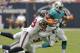 HOUSTON,TX - SEPTEMBER 09: Reggie Bush #22 of the Miami Dolphins brought down by Glover Quin #29 of the Houston Texans and Danieal Manning #38 of the Houston Texans during the season opener at Reliant Stadium on September 9, 2012 in Houston, Texas. (Photo by Bob Levey/Getty Images)