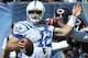 CHICAGO, IL- SEPTEMBER 09: Andrew Luck #12 of the Indianapolis Colts is grabbed by Julius Peppers #90 of the Chicago Bears on September 9, 2012 during their 2012 NFL season opener at Soldier Field in Chicago, Illinois. (Photo by David Banks/Getty Images)