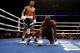 OAKLAND, CA - SEPTEMBER 08: Andre Ward (L) stands over Chad Dawson after he knocked him down in the third round of their WBA/WBC Super Middleweight championship fight at ORACLE Arena on September 8, 2012 in Oakland, California. Ward won by TKO in the 10th round. (Photo by Ezra Shaw/Getty Images)