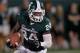 EAST LANSING, MI - AUGUST 31: Le'Veon Bell #24 of the Michigan State Spartans looks for running room during a third quarter run while playing the Boise State Broncos at Spartan Stadium on August, 2010 in East Lansing, Michigan. (Photo by Gregory Shamus/Getty Images)
