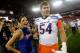 GLENDALE, AZ - JANUARY 04: Michael Ames #54 of the Boise State Broncos puts his arm around a cheerleader after the Broncos 17-10 victory against the TCU Horned Frogs during the Tostitos Fiesta Bowl at the Universtity of Phoenix Stadium on January 4, 2010 in Glendale, Arizona. (Photo by Jamie Squire/Getty Images)