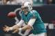 HOUSTON,TX - SEPTEMBER 09: Ryan Tannehill #17 of the Miami Dolphins fumbles the snap in the first quarter against the Houston Texans during the season opener at Reliant Stadium on September 9, 2012 in Houston, Texas. (Photo by Bob Levey/Getty Images)