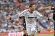 MADRID, SPAIN - SEPTEMBER 02: Cristiano Ronaldo of Real Madrid competes for the ball with Guilherme M. Siqueira (R) of Granada during the La Liga match between Real Madrid and Granada at Estadio Santiago Bernabeu on September 2, 2012 in Madrid, Spain. (Photo by Gonzalo Arroyo Moreno/Getty Images)