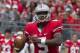 September 8, 2012; Columbus, OH, USA; Ohio State Buckeyes quarterback Braxton Miller (5) looks for an open receiver against the UCF Knights at Ohio Stadium. Mandatory Credit: Greg Bartram-US PRESSWIRE