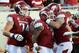 Sep 8, 2012; Little Rock, AR, USA; Arkansas Razorbacks running back Knile Davis (7) celebrates with offensive tackle Brey Cook (74) and teammates after rushing for a touchdown in the second quarter against the Louisiana Monroe Warhawks at War Memorial Stadium. Mandatory Credit: Nelson Chenault-US PRESSWIRE