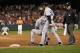 BALTIMORE, MD - SEPTEMBER 08: First base umpire Jerry Meals walks away after calling Mark Teixeira #25 of the New York Yankees out for the last out of the game during the Yankees 5-4 loss to the Baltimore Orioles at Oriole Park at Camden Yards on September 8, 2012 in Baltimore, Maryland. At right is first base coach Mick Kelleher. (Photo by Rob Carr/Getty Images)