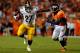 DENVER, CO - SEPTEMBER 09: Running back Jonathan Dwyer #27 of the Pittsburgh Steelers rishes with the ball and fends off defensive back Mike Adams #20 of the Denver Broncos at Sports Authority Field at Mile High on September 9, 2012 in Denver, Colorado. (Photo by Doug Pensinger/Getty Images)