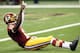 NEW ORLEANS, LA - SEPTEMBER 09: Robert Griffin III #10 of the Washington Redskins celebrates a touchdown against the New Orleans Saints during the season opener at Mercedes-Benz Superdome on September 9, 2012 in New Orleans, Louisiana. (Photo by Ronald Martinez/Getty Images)