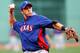 BOSTON, MA - AUGUST 06: Mike Olt #9 of the Texas Rangers takes ground balls during batting practice prior to the game against the Boston Red Sox on August 6, 2012 at Fenway Park in Boston, Massachusetts. (Photo by Jared Wickerham/Getty Images)