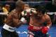 LAS VEGAS, NV - JUNE 09: (L-R) Timothy Bradley lands a left to the head of Manny Pacquiao during their WBO welterweight title fight at MGM Grand Garden Arena on June 9, 2012 in Las Vegas, Nevada. (Photo by Jeff Bottari/Getty Images)