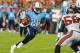 TAMPA, FL - AUGUST 17: Running back Chris Johnson #28 of the Tennessee Titans rushes upfield against the Tampa Bay Buccaneers in an NFL preseason game August 17, 2012 at Raymond James Stadium in Tampa, Florida. (Photo by Al Messerschmidt/Getty Images)