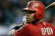 PHOENIX, AZ - AUGUST 29: Justin Upton #10 of the Arizona Diamondback stands in the on-deck circle as he waits to bat against the Cincinnati Reds during a MLB game at Chase Field on August 29, 2012 in Phoenix, Arizona. (Photo by Ralph Freso/Getty Images)