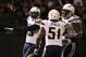 September 10, 2012; Oakland, CA, USA; San Diego Chargers linebacker Shaun Phillips (95, left), linebacker Takeo Spikes (51), and linebacker Shaun Phillips (95) celebrate after a play during the fourth quarter against the Oakland Raiders at O.co Coliseum. The Chargers defeated the Raiders 22-14. Mandatory Credit: Kelley L Cox-US PRESSWIRE
