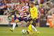 COLUMBUS, OH - SEPTEMBER 11: Danny Williams #14 of the U.S. National Team defends against Ryan Johnson #9 of the Jamaican National Team on September 11, 2012 at Crew Stadium in Columbus, Ohio. (Photo by Jamie Sabau/Getty Images)