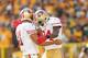 GREEN BAY, WI - SEPTEMBER 09: Alex Smith #11 and Randy Moss #84 of the San Francisco 49ers celebrate after Moss caught a touchdown pass during the NFL season opener against the Green Bay Packers at Lambeau Field on September 9, 2012 in Green Bay, Wisconsin. (Photo by Andy Lyons/Getty Images)
