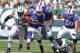 Sept 9, 2012; East Rutherford, NJ, USA; Buffalo Bills running back Fred Jackson (22) breaks a tackle by New York Jets linebacker Bart Scott (57) during the first half at MetLife Stadium. Mandatory Credit: Ed Mulholland-US PRESSWIRE
