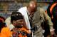 LAS VEGAS, NV - SEPTEMBER 17: Rapper 50 Cent sits at the table as he is hugged by Floyd Mayweather Jr. during the post-fight news conference after Mayweather Jr. knocks out Victor Ortiz in the WBC welterweight title fight at the MGM Grand Garden Arena on September 17, 2011 in Las Vegas, Nevada. (Photo by Ethan Miller/Getty Images)