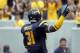 PITTSBURGH, PA - SEPTEMBER 01: Isaiah Bruce #31 of the West Virginia Mountaineers celebrates after returning a fumble for a touchdown in the third quarter against the Marshall Thundering Herd during the game on September 1, 2012 at Mountaineer Field in Morgantown, West Virginia. (Photo by Justin K. Aller/Getty Images)