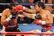 Manny Pacquiao raining a punch onto Marquez