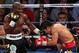 LAS VEGAS, NV - JUNE 09: (L-R) Timothy Bradley lands a left to the head of Manny Pacquiao during their WBO welterweight title fight at MGM Grand Garden Arena on June 9, 2012 in Las Vegas, Nevada. (Photo by Jeff Bottari/Getty Images)