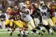 NEW ORLEANS, LA - SEPTEMBER 09: Robert Griffin III #10 of the Washington Redskins breaks the tackle by Will Smith #91 of the New Orleans Saints during the season opener at Mercedes-Benz Superdome on September 9, 2012 in New Orleans, Louisiana. (Photo by Ronald Martinez/Getty Images)