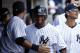 NEW YORK, NY - SEPTEMBER 01: Eduardo Nunez #26 of the New York Yankees is greeted in the dugout after scoring against the Baltimore Orioles during a game at Yankee Stadium on September 1, 2012 in the Bronx borough of New York City. (Photo by Jeff Zelevansky/Getty Images)
