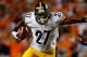 DENVER, CO - SEPTEMBER 09: Running back Jonathan Dwyer #27 of the Pittsburgh Steelers rishes with the ball and fends off defensive back Mike Adams #20 of the Denver Broncos at Sports Authority Field at Mile High on September 9, 2012 in Denver, Colorado. (Photo by Doug Pensinger/Getty Images)