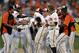 Manny Machado mobbed by teammates after 14th inning walkoff..