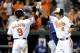 BALTIMORE, MD - SEPTEMBER 11: J.J. Hardy #2 of the Baltimore Orioles celebrates with Nate McLouth #9 after hitting a home run in the eighth inning against the Tampa Bay Rays at Oriole Park at Camden Yards on September 11, 2012 in Baltimore, Maryland. Baltimore won the game 9-2. (Photo by Greg Fiume/Getty Images)
