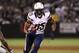 September 10, 2012; Oakland, CA, USA; San Diego Chargers tight end Antonio Gates (85) runs with the ball defended by Oakland Raiders defensive back Ron Bartell (21) during the first half at O.co Coliseum. Mandatory Credit: Kelley L Cox-US PRESSWIRE