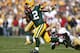 GREEN BAY, WI - SEPTEMBER 9: Aaron Rodgers #12 of the Green Bay Packers runs away from pursuit by Aldon Smith #99 of the San Francisco 49ers in the first half of the game at Lambeau Field on September 9, 2012 in Green Bay, Wisconsin. (Photo by Joe Robbins/Getty Images)