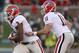 COLUMBIA , MO - SEPTEMBER 8: Aaron Murray #11 of the Georgia Bulldogs hands the ball off to running back Todd Gurley #3 of the Georgia Bulldogs during their game against the Missouri Tigers in the first quarter at Memorial Stadium on September 8, 2012 in Columbia, Missouri. (Photo by Ed Zurga/Getty Images)