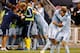 KANSAS CITY, KS - SEPTEMBER 14: Graham Zusi #8 of Sporting KC is congratulated by teammates after assisting a goal during the MLS game against the Houston Dynamo at Livestrong Sporting Park on September 14, 2012 in Kansas City, Kansas. (Photo by Jamie Squire/Getty Images)