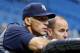 ST. PETERSBURG - SEPTEMBER 03: Manager Joe Girardi #28 and General Manager Brian Cashman of the New York Yankees watch their team during batting practice just before the start of the game against the Tampa Bay Rays at Tropicana Field on September 3, 2012 in St. Petersburg, Florida. (Photo by J. Meric/Getty Images)