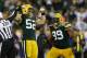 GREEN BAY, WI - SEPTEMBER 13: Clay Matthews #52 and Jerel Worthy #99 of the Green Bay Packers celebrate after a sack during first half play against the Chicago Bears at Lambeau Field on September 13, 2012 in Green Bay, Wisconsin. (Photo by Joe Robbins/Getty Images)