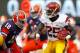 EAST RUTHERFORD, NJ - SEPTEMBER 8: Silas Redd #25 of the USC Trojans looks for an opening to run as Siriki Diabate #18 of the Syracuse Orange closes in during a game at MetLife Stadium on September 8, 2012 in East Rutherford, New Jersey. (Photo by Rich Schultz /Getty Images)
