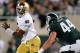 EAST LANSING, MI - SEPTEMBER 15: Everett Golson #5 of the Notre Dame Fighting Irish runs from the tackle of Marcus Rush #44 of the Michigan State Spartans during the first quarter at Spartan Stadium on September 15, 2012 in East Lansing, Michigan. (Photo by Gregory Shamus/Getty Images)