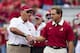 Arkansas head coach John Smith shakes hands with Nick Saban