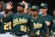 SEATTLE, WA - SEPTEMBER 09: Yoenis Cespedes #52 and other members of the Oakland Athletics celebrate after defeating the Seattle Mariners 4-2 at Safeco Field on September 9, 2012 in Seattle, Washington. (Photo by Otto Greule Jr/Getty Images)