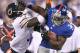 EAST RUTHERFORD, NJ - AUGUST 24: David Wilson #34 of the New York Giants is shoves by Charles Tillman #33 of the Chicago Bears during a preseason game on August 24, 2012 at MetLife Stadium in East Rutherford, New Jersey. (Photo by Elsa/Getty Images)