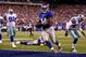 EAST RUTHERFORD, NJ - SEPTEMBER 05: running back Ahmad Bradshaw #44 of the New York Giants scores a touchdown in the third quarter past free safety Gerald Sensabaugh #43 of the Dallas Cowboys during the 2012 NFL season opener at MetLife Stadium on September 5, 2012 in East Rutherford, New Jersey. (Photo by Jeff Zelevansky/Getty Images)