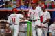 MIAMI, FL - AUGUST 13: Jimmy Rollins #11 of the Philadelphia Phillies celebrates with Ryan Howard #6 after scoring during a game against the Miami Marlins at Marlins Park on August 13, 2012 in Miami, Florida. (Photo by Sarah Glenn/Getty Images)