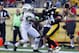 PITTSBURGH, PA - SEPTEMBER 16: Antonio Brown #84 of the Pittsburgh Steelers stiff arms Ellis Lankster #26 of the New York Jets during the game on September 16, 2012 at Heinz Field in Pittsburgh, Pennsylvania. (Photo by Justin K. Aller/Getty Images)