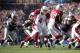 Sep 16, 2012; Foxboro, Massachusetts, USA; Arizona Cardinals quarterback Kevin Kolb (4) hands the ball off to running back Beanie Wells (26) during the fourth quarter at Gillette Stadium. The Arizona Cardinals won 20-18. Mandatory Credit: Greg M. Cooper-US PRESSWIRE