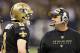 NEW ORLEANS, LA - DECEMBER 26: Quarterback Drew Brees #9 and Head Coach Sean Payton of the New Orleans Saints talk on the sidelines during a game against the Atlanta Falcons at Mercedes-Benz Superdome on December 26, 2011 in New Orleans, Louisiana. The Saints defeated the Falcons 45-16. (Photo by Wesley Hitt/Getty Images)