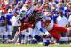 Sep 16, 2012; Orchard Park, NY, USA; Kansas City Chiefs inside linebacker Derrick Johnson (56) and defensive back Travis Daniels (34) tackle Buffalo Bills running back Tashard Choice (20) during the first quarter at Ralph Wilson Stadium. Mandatory Credit: Kevin Hoffman-US PRESSWIRE